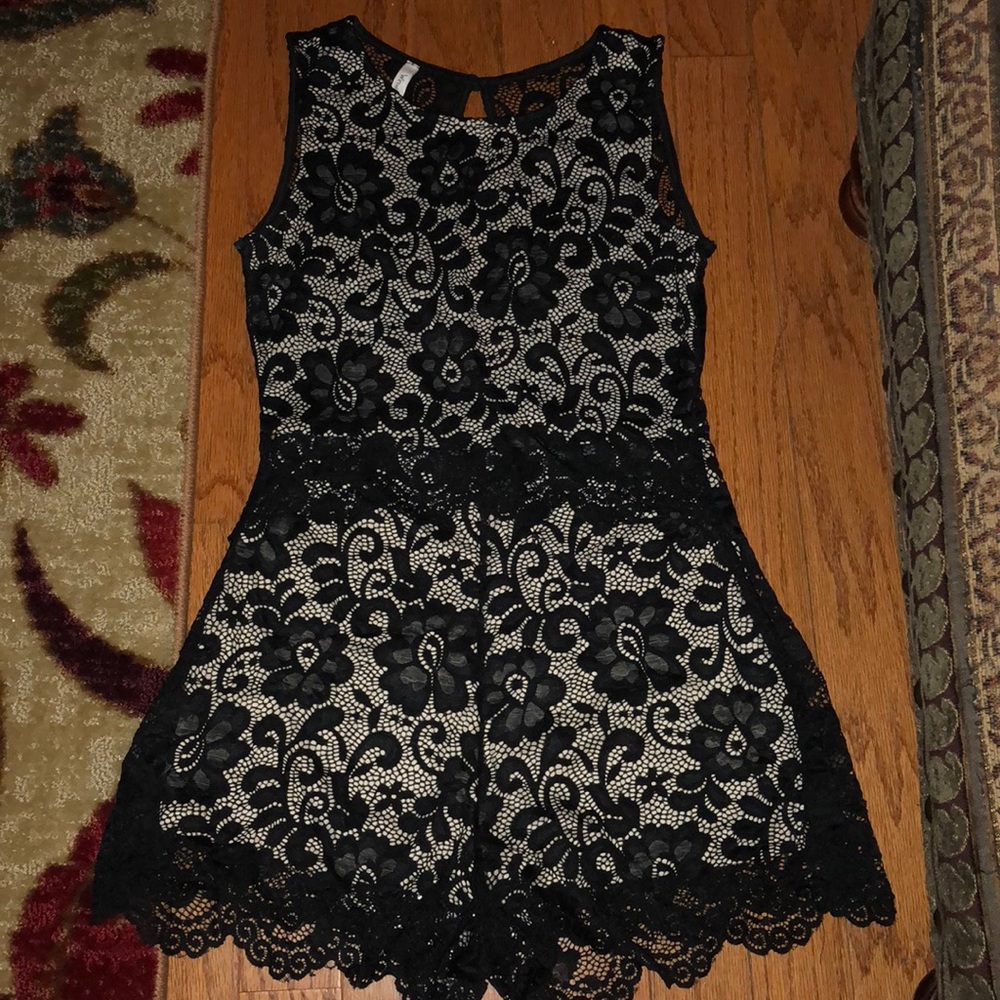Black lace romper over nude overlay